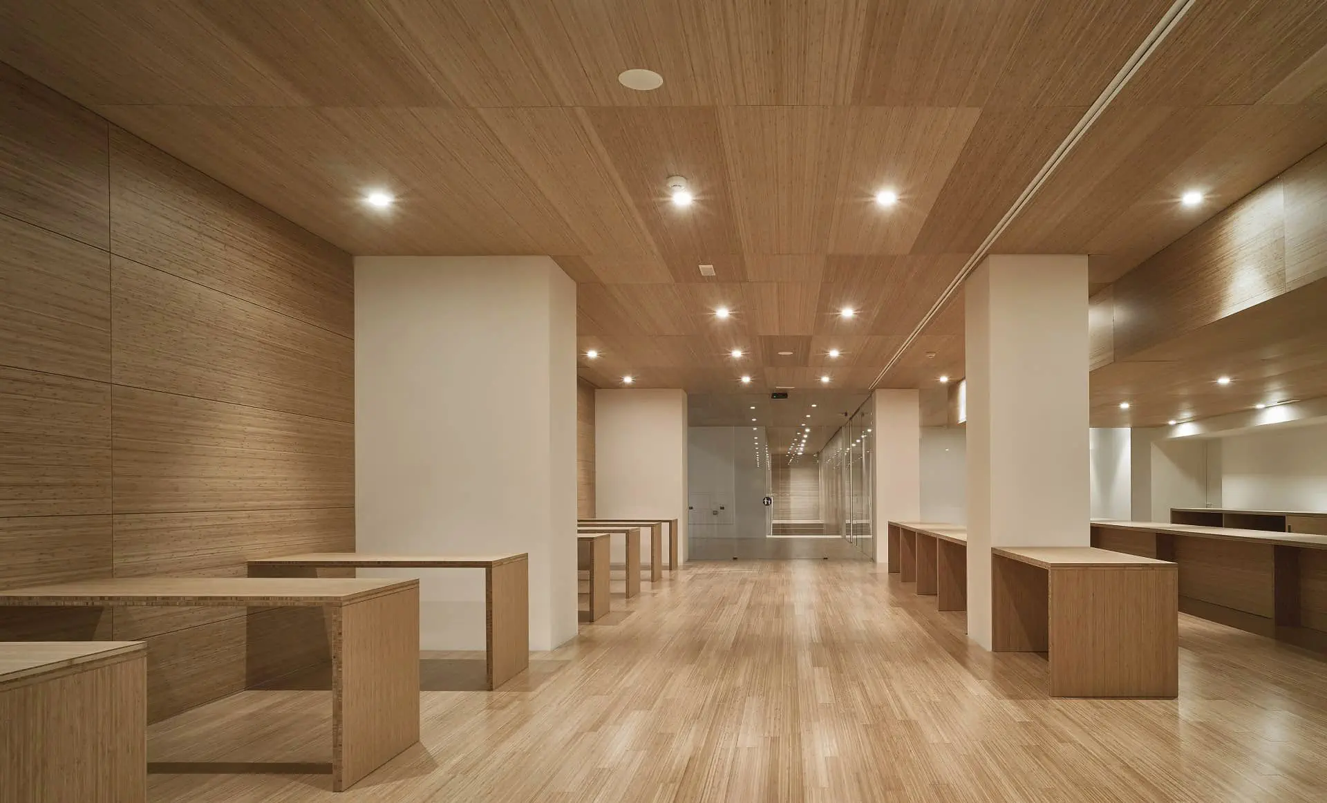 A completed woodgrain ceiling with integrated lighting