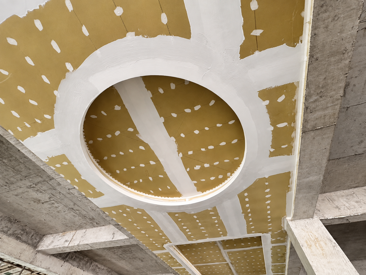 Mineral board being installed in a shaped ceiling